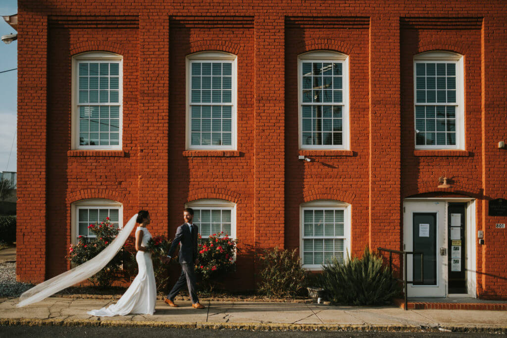 bride and groom outside of downtown durham wedding space